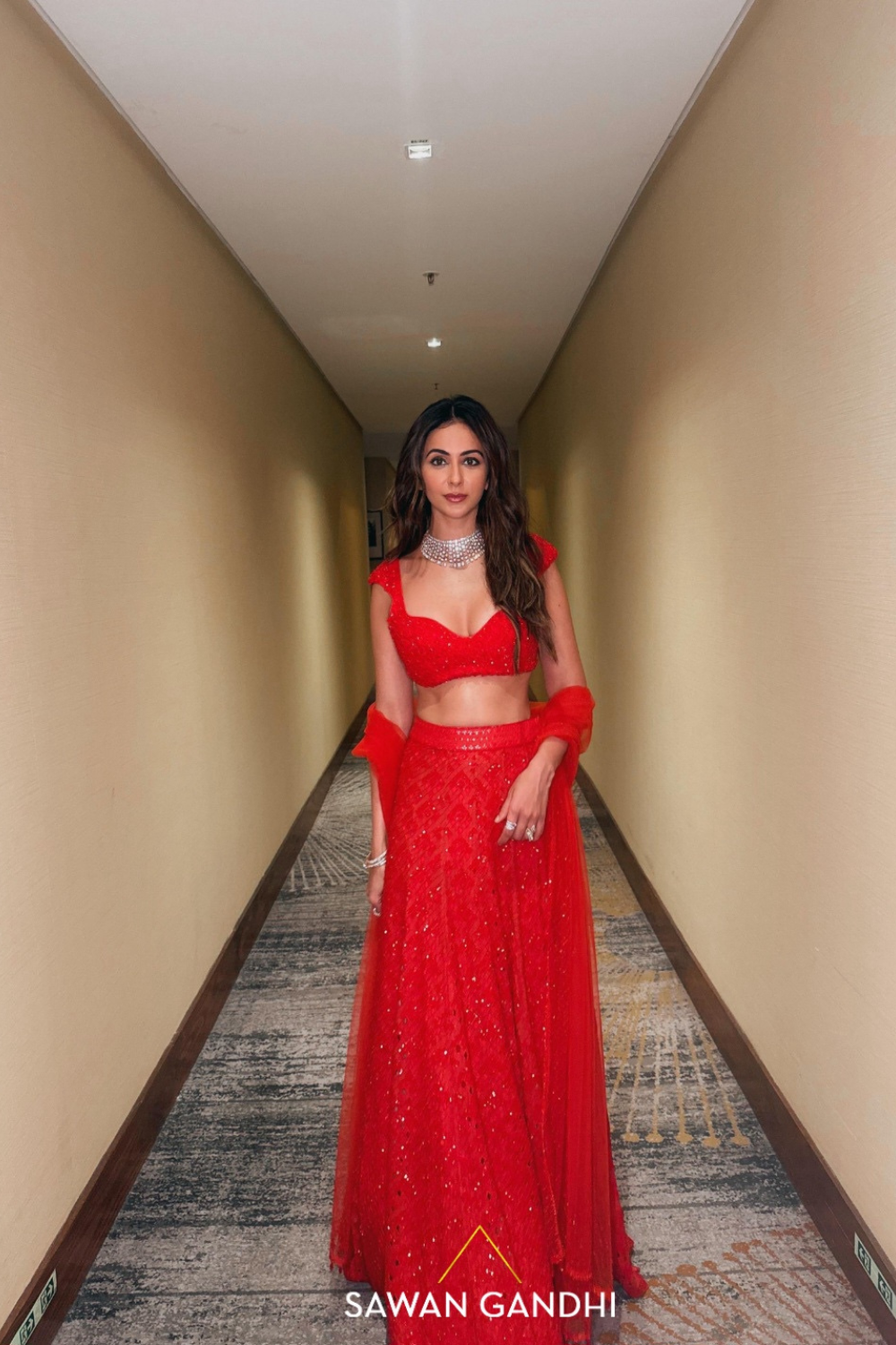 Rakulpreet in red orange cutwork lehenga