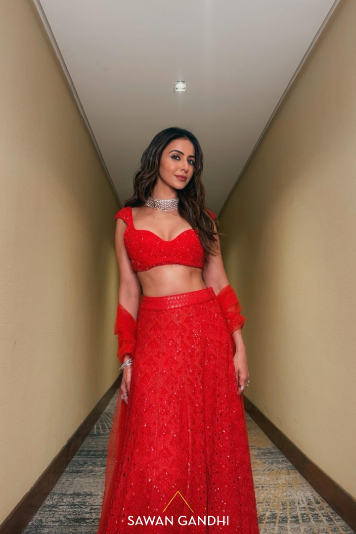 Rakulpreet in red orange cutwork lehenga