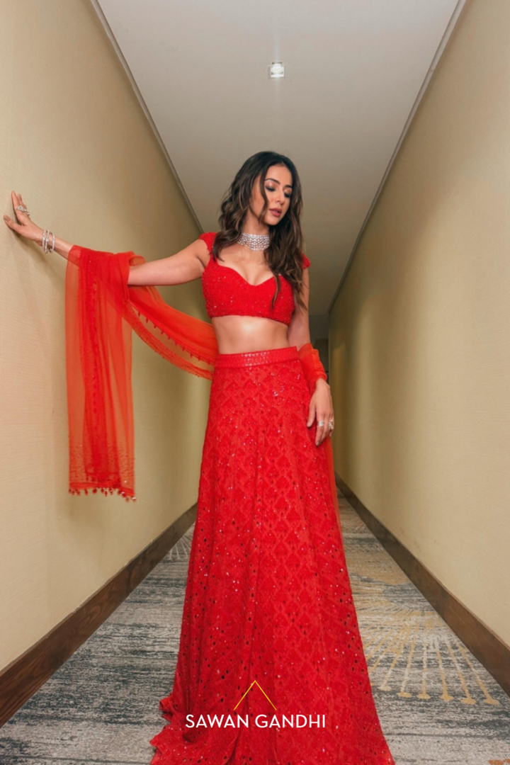 Rakulpreet in red orange cutwork lehenga