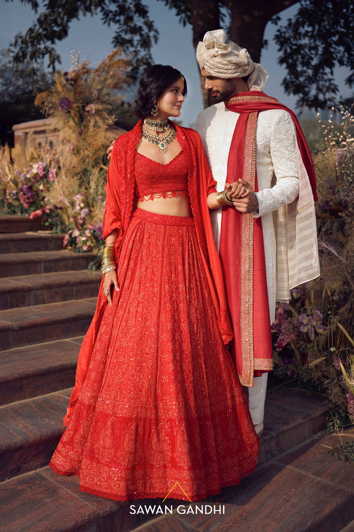 THE ORANGE-RED CHIKANKARI LEHENGA