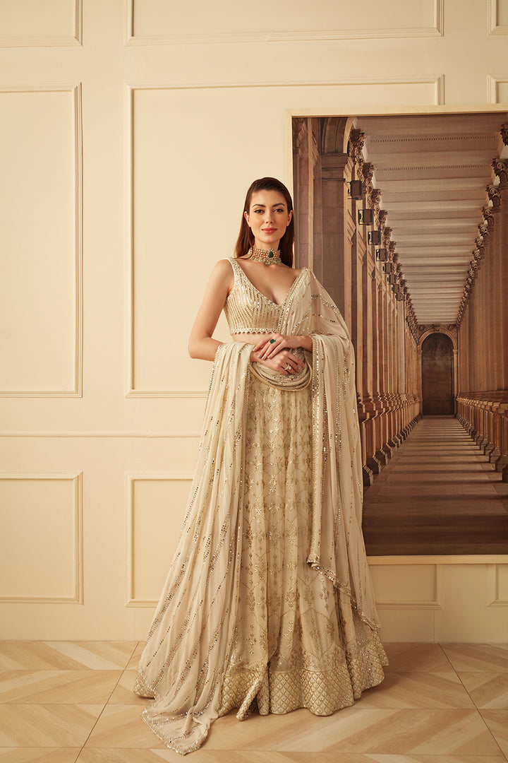Ivory and gold badala work lehenga set